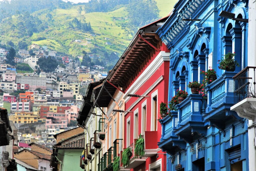 colorful architecture and green mountains quito ecuador